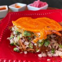 Mulita  · Two corn tortillas with cheese , birria ,onions and cilantro .