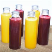 Immune Shot · 100% All Natural. Includes: Orange, Lemon, Lime, Ginger, Turmeric, and Honey.