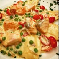 Ravioli Special · Lobster Ravioli sautéed with fresh Salmon, shallots, cherry tomatoes, green peas and a light...