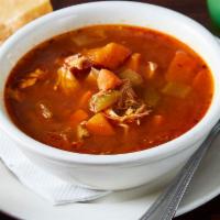 Chicken Tortilla Soup · Pulled chicken, crispy tortilla chips, carrots, celery, and Mexican peppers