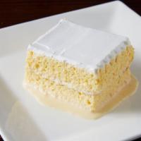 Tres Leches Cake · Sponge cake soaked in three different types of milks accompanied by whipped frosting on top....