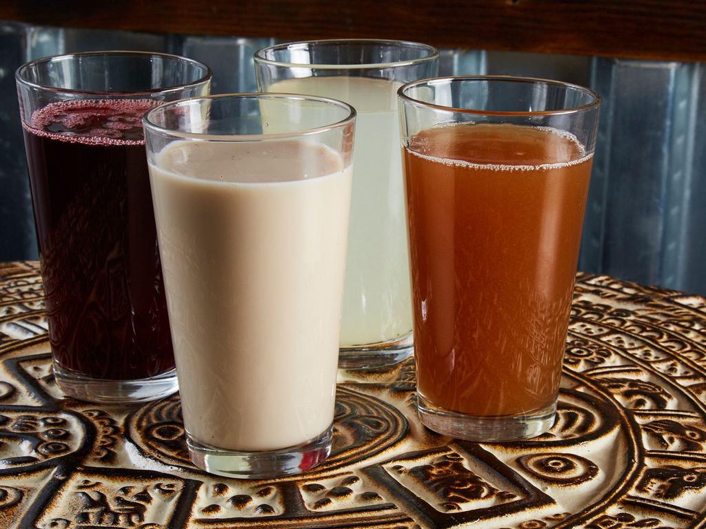 Homemade Aguas Frescas · All juices are made fresh DAILY from scratch. Homemade Horchata, Lemonade, Watermelon, Jamaica (hibiscus flower), and Tamarind.