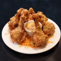 4. Lollipop Chicken · Pulled back chicken wings battered and fried to golden perfection