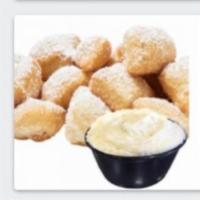 Vanilla Fried Dough · Our original Fried Dough + topped with powdered sugar + served with a side of VANILLA Frosti...