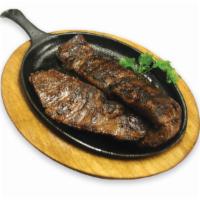35. Entraña Asada · Grilled skirt steak. It comes with rice, salad and beans or french fries.