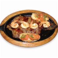 39. Churrasco con Camarones BBQ · BBQ sirloin steak with shrimp, rice, salad and beans or french fries.