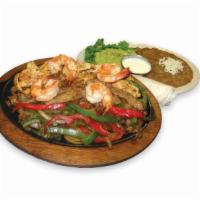 58. Fajitas Mixtas Specialty · Grilled chicken, beef, shrimp with sauteed peppers and onions. It comes with beans, guacamol...