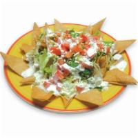 60. Nachos Specialty · Chips, meat, pico de gallo and sour cream.
