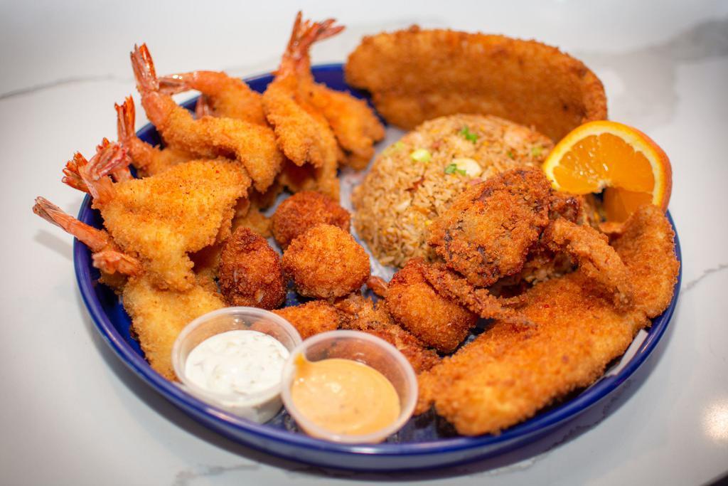 The Ultimate Seafood Platter · 2 fish, 12 shrimp, 6 scallops and 1 soft shell crab.