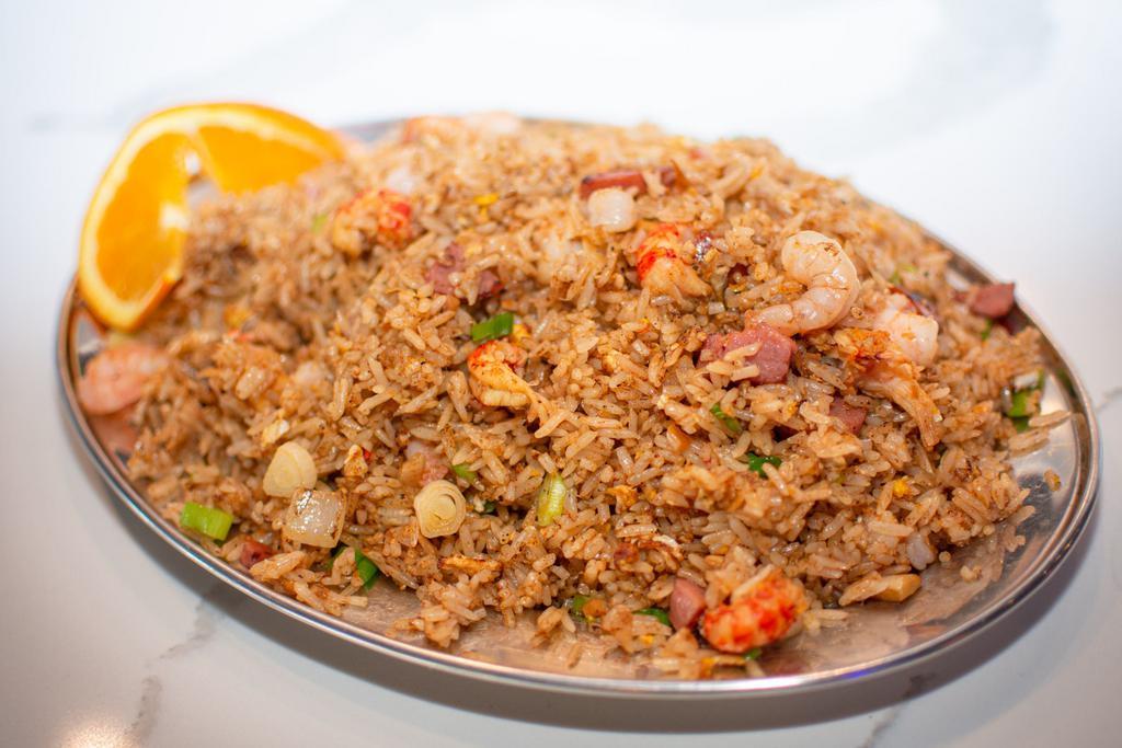 Yummy Fried Rice · Served with sausage, shrimp, crawfish and crabmeat.