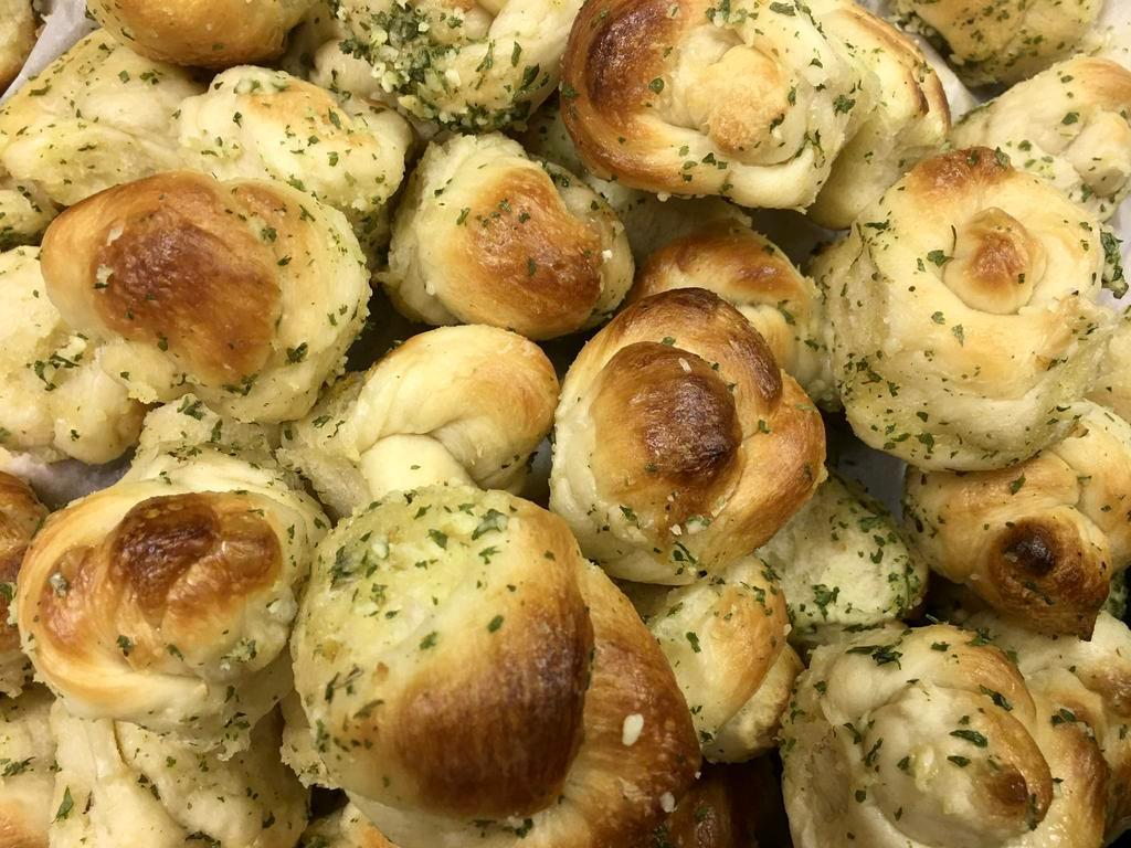 Garlic Knots · Homemade. Served with our homemade marinara. Add cheese for an extra charge.
