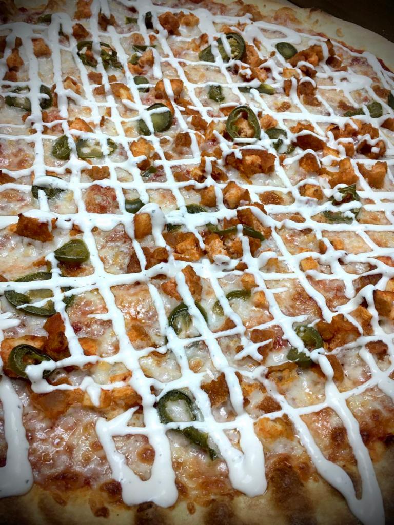 Chicken Inferno Pizza · Tomato sauce, mozzarella, jalapenos, Buffalo chicken and topped with ranch out of the oven. Our pizza dough and tomato sauce are fat free and sugar free. Healthy and delicious