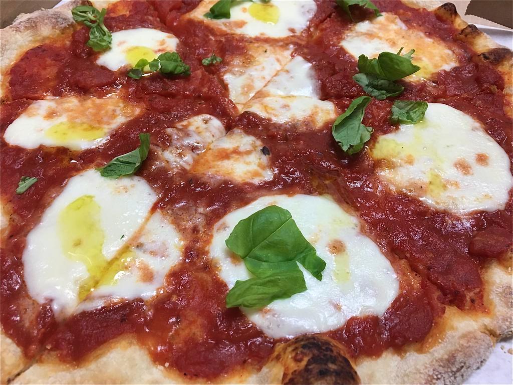 Margherita pizza · Pureed Italian plum tomatoes, fresh OVOLINE mozzarella, fresh basil and extra virgin olive oil. Our pizza dough and tomatoes are fat free and sugar free. Healthy and delicious