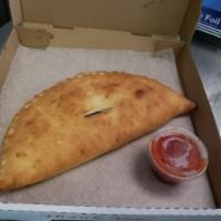 Macdaddy Calzone · Mozzarella, cheddar, meatball, onions, pickles and 1000 Island.