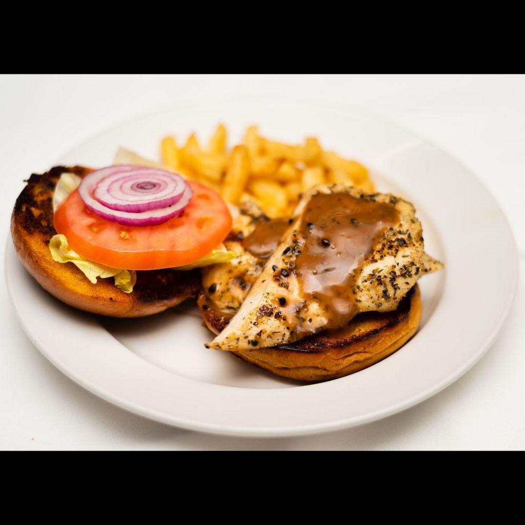 Grilled Herbal Chicken Sandwich · Served with lettuce, tomato, and balsamic dressing.