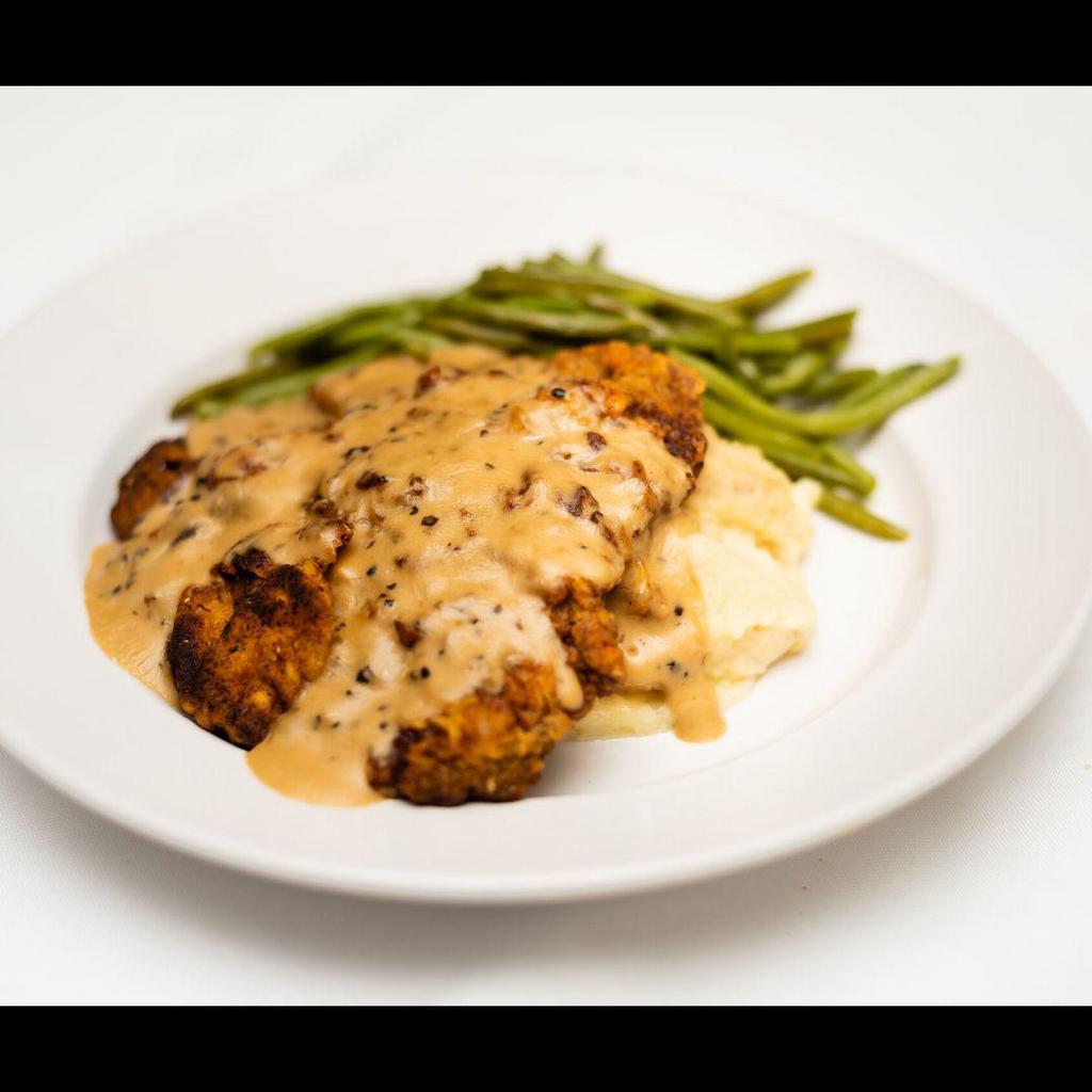 Country Fried Steak · Served with black pepper cream sauce.