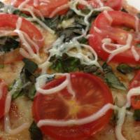 Margherita Pizza · Made with fresh mozzarella, marinara sauce and basil.