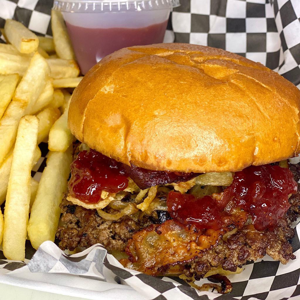 Deluxe PB&J Burger · All beef patty, creamy peanut butter, strawberry jam, grilled sweet onion, bacon, topped with crunchy onions on a toasted brioche bun. 