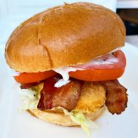 Chicken Ranch BLT · Chicken patty topped with bacon, lettuce, tomato, and a creamy ranch sauce on a toasted brio...