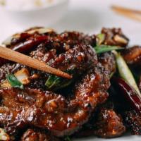 B4. Mongolian Beef · Cooked with brown sauce and vegetables.