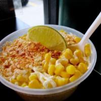 ESQUITES · elotes—grilled Mexican street corn slathered with creamy, cheesy, lime-scented, chili-flecke...