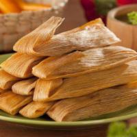 TAMALES · Tamales are a traditional Mexican dish made with a corn based dough mixture that is filled w...