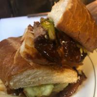 Pork Tenderloin Sandwich · Bourbon BBQ sauce, vidalia onions, pickles