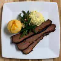 Brisket Plate · Slow-cooked beef brisket served with two sides of your choosing and cornbread.