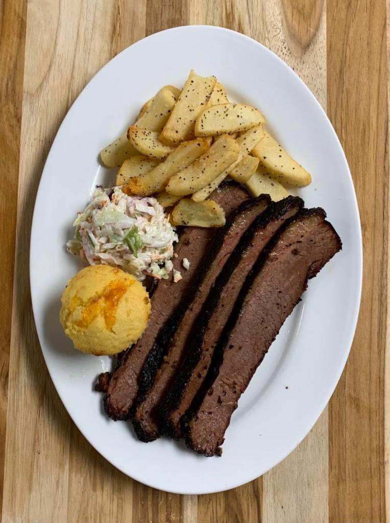 Double Brisket Plate · Double the portion of our beef brisket with two sides of your choosing and cornbread.