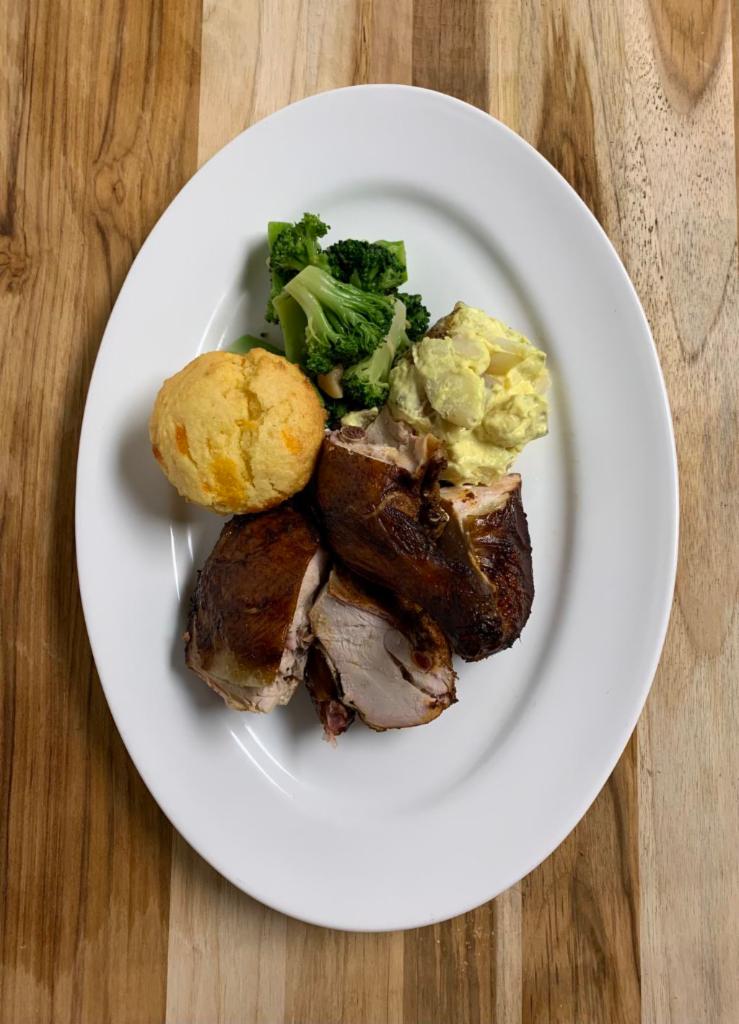 Half Chicken Plate · Half our smoked chicken served with two sides of your choosing and cornbread.