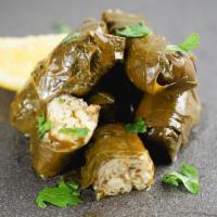 Stuffed Grape Leaves · Stuffed grape leaves with herbs and rice. Served with side of Tzatziki