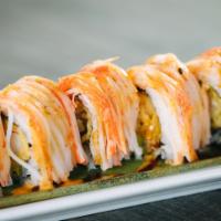 Justin Roll · Shrimp tempura, avocado, topped with crabstick, eel sauce, spicy mayo and sweet chili.