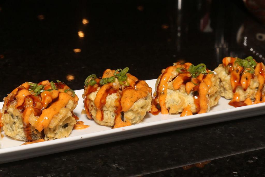 Dallas Roll · Spicy crawfish, spicy crab, avocado, cream cheese, deep fried topped with spicy mayo, eel sauce and scallion.