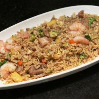 Hawaii Fried Rice · Pineapple, shrimp and chicken. Short grain Japanese rice, peas, carrot, cabbage, onions and ...