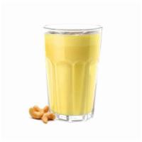 Golden Mylk Smoothie · Almond milk, cashew, coconut oil, dates, turmeric, ginger, black pepper and dash of sea salt.
