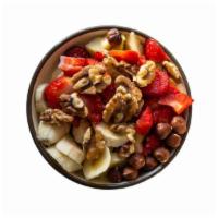 Nutella Bowl · Ground level: granola and Nutella toppings: granola, strawberries, banana and Nutella drizzle.