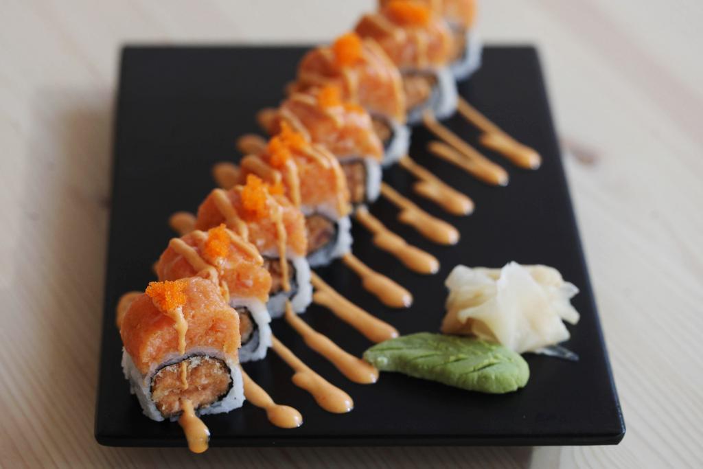 Island Girl Roll · 8 Pieces of Spicy tuna, spicy salmon and tempura flakes topped with spicy yellowtail scallion.