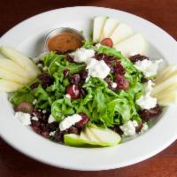 Arugula Salad · Apples, dried cranberries, grapes and goat cheese.