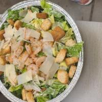 Caesar Salad · Romaine lettuce with anchovies, croutons, and shaved Parmesan cheese. 