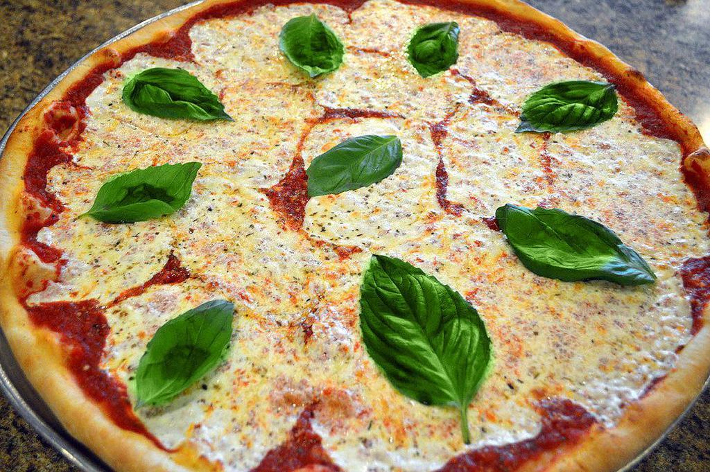 Margherita Pizza · San Marzano tomatoes, garlic, basil, olive oil and fresh mozzarella.