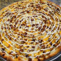 Chicken Bacon Ranch Pizza · Served with chicken, cheddar cheese and ranch dressing.
