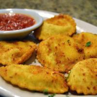 Fried Ravioli · 6 pieces. Ravioli filled with cheesy goodness, breaded and deep-fried until the pasta shell ...