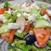 Greek Salad · Tomatoes, cucumbers, Kalamata olives, and feta cheese.