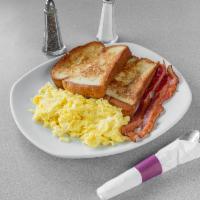 Brioche French Toast Platter · Two slices of brioche French toast served with two eggs and choice of two bacon strips or sa...