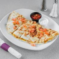 Chicken and Cheese Quesadilla · Grilled Cajun chicken breast, American cheese, and Pepper Jack cheese in a grilled flour tor...