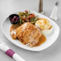 Turkey Dinner · Oven-roasted turkey on sage dressing with turkey gravy and cranberry sauce. Served with two ...