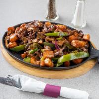 Steak and Peppers Skillet · Steak tips with tender red peppers, grilled onions,
mushrooms and a rich beef gravy served o...