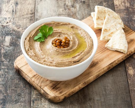 Hummus with Pita · Made from garbanzo beans and cooked till tender, then blended to perfection with tahini, garlic, lemon, and a lot of flavors.