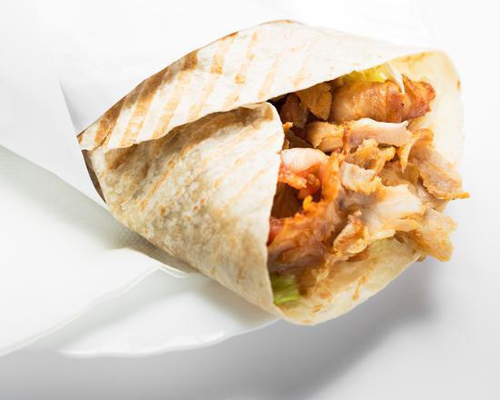 Halal Lamb and Chicken Gyro in Pita · Halal lamb and chicken with vegetables stuffed in a fresh hot pita.