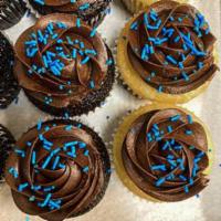 Vanilla Cupcake with Chocolate Buttercream · Vanilla cupcakes with a rich dark chocolate buttercream frosting, and sprinkles.